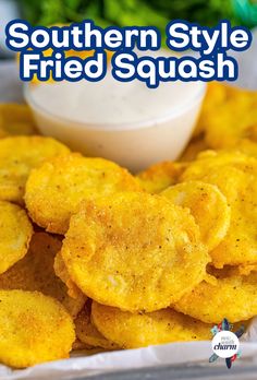 the southern style fried squash is ready to be eaten and served with ranch dressing on the side