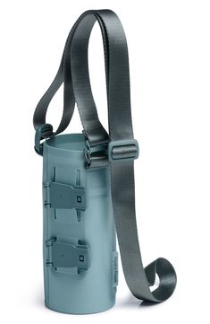 an empty water bottle with strap attached to the back and shoulder straps on it, against a white background