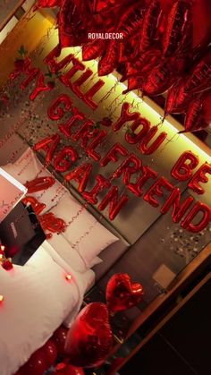 red balloons and white pillows are on display