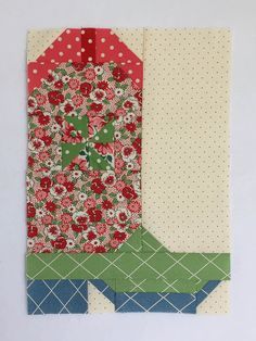 two pieces of fabric with flowers and polka dots on the top one piece is folded in half