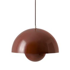 a large brown light hanging from a ceiling