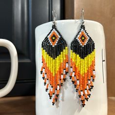 Earrings Beaded Dangling Navajo, White, Orange, Black, Yellow Earrings 2” Fast Shipping Pet And Smoke-Free Seller Like New Condition Never Worn Black Southwestern Dangle Earrings, Yellow Beaded Drop Earrings For Festival, Yellow Teardrop Bohemian Jewelry, Adjustable Southwestern Black Earrings, Yellow Beaded Earrings With Ear Wire For Festivals, Yellow Teardrop Beaded Earrings With Dangling Beads, Black Dangle Jewelry With Large Beads, Artisan Yellow Jewelry With Dangling Beads, Traditional Orange Jewelry With Black Beads