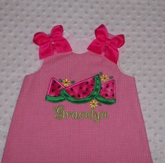 This is a 2 piece set that includes a-line top with applique. Top is completely lined on the inside and buttons at the shoulders. Pants have a comfy elastic waist. Monogramming is included (no additional charge) Bows are pinned on for easy removal and are heat sealed to prevent frayng. Available in your size choice from Newborn up to size 6X. NOTE, CHOICES FOR BOTTOMS: You can choose bloomers, pantaloons (pants style that has the elastic at the bottom), capri/cropped length pants or full length Applique Top, Applique Monogram, Green Gingham, Pants Style, Fashion Pants, Lime Green, 2 Piece, Gingham