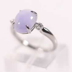 This Exquisite Ring Crafted From 950 Platinum Showcases A Central Cabochon-Cut Lavender Jade, Securely Nestled Within A Four-Prong Setting Also Crafted From 950 Platinum. The Natural White Luster Of The Platinum Enhances The Delicate Hue Of The Jade, While Two Round Brilliant-Cut Diamonds On Each Side Add A Complementary Sparkle. Combining The Unique Charm Of Lavender Jade With The Brilliance Of Diamonds, This Piece Is Elegantly Set In A High-Quality Platinum Band. It Bears The Stamp Pt950, 2.50 Gemstone Rings Silver, Round Amethyst Ring In Platinum, Fine Jewelry Amethyst Ring In Platinum, Fine Jewelry Amethyst Platinum Ring, Elegant White Gold Solitaire Opal Ring, Platinum Amethyst Ring In White Gold, Oval Amethyst Ring In Silver Platinum, Silver Platinum Amethyst Ring, Platinum Amethyst Wedding Ring