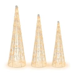 three small plastic christmas trees on a white background