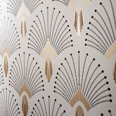 an art deco wallpaper pattern with gold and black designs on white paper, featuring fan shaped shapes