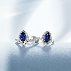 Indulge in the allure of the "ENDLESS BLUE" Luxe Crown Pear Shaped Sapphire Ring, a true masterpiece that combines regal elegance with sustainable luxury. This exquisite ring is available in various options: S925 Silver, 10K Gold, 14K Gold, 18K Gold, and Platinum, ensuring a perfect match for your style and preference.At the center of the ring shines a brilliant lab-grown pear-shaped sapphire, capturing the essence of endless oceans. Surrounding the sapphire are sparkling moissanite stones, addi Environmental Consciousness, Regal Elegance, Sapphire Rings, Sparkle Jewelry, Engraved Items, Jewelry Cleaner, Blue Rings, High Quality Jewelry, 10k Gold