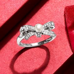 Ross-Simons - 4-4.5mm Cultured Pearl, .25ct t. w. Diamond Bow Ring in Silver. Size 9. All wrapped up in radiant sparkle, our on-trend .25 ct. t. w. round diamond bow ring invites a luminous 4-4.5mm cultured freshwater pearl to center stage. Finely crafted in polished sterling silver. 1/4" wide. Diamond and white pearl bow ring. Pearl birthstones are the perfect gift for June birthdays. Pearl Birthstone, Ring Pearl, Pearl Bow, Diamond Bows, June Birthday, Bow Ring, Pearl Diamond, Center Stage, White Pearl