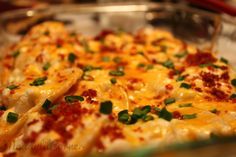 a cheesy casserole with cheese and green onions