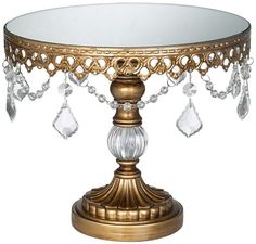 an ornately decorated cake stand with crystal beads