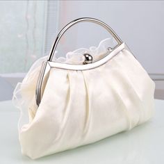 Cream Party Shoulder Bag, Cream Shoulder Bag For Party, Party Cream Top Handle Bag, Cream Evening Clutch Bag, Cream Top Handle Party Bag, Cream Top Handle Party Bags, Cream Top Handle Bag For Party, Cream Pouch Bag For Party, Elegant Satchel Cosmetic Bag