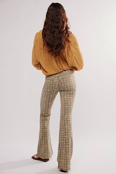 Classic Free People pull-on flares are in a bold boho print featured in a mid-rise with an elastic waistband. * Clean silhouette with a flat front & perfectly placed back pockets * Flare leg * Stretch fabric * Back knee seam detailing | We The Free Penny Pull-On Printed Flare Jeans at Free People in Brown, Size: 30 70s Inspired Flare Bottoms For Spring, Fitted Bohemian Flares For Spring, Bohemian Flare Stretch Bottoms, Bohemian Stretch Flare Bottoms, Bohemian Spring Bottoms With Flared Hem, Printed Bohemian Bottoms For Fall, Bohemian Printed Bottoms For Fall, Fall Printed Bohemian Bottoms, Fall Bohemian Printed Bottoms