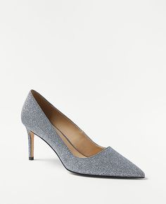 Elevate your evening look with the Ann Taylor Glitter Straight Heel Pumps, a blend of glamour and sophistication. These pumps feature a sleek, pointy toe design that adds a touch of elegance to any outfit.

- Size: 7
- Color: Silver
- Gender: Female
- Material: 50% Polyurethane, 30% Polyethylene Terephthalate, 20% Polyester
- Heel Height: 3 inches

Crafted with a padded footbed for complete comfort and a dazzling glittery finish, these high heels are perfect for special occasions or a night out. Glitter Pumps, Knitted Suit, Polyethylene Terephthalate, Heel Pumps, Toe Designs, Silver Glitter, Pumps Heels, Effortless Style, Ann Taylor