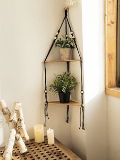 a wooden table topped with a shelf filled with potted plants