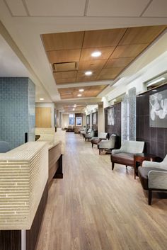 an empty waiting room with chairs and tables