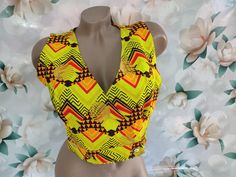 90s Vintage women's neon short vest abstract print. Size S-M. Vest in excellent vintage condition. Bust 90cm(35.4inch), Vest Length 39cm(15.3inch). Trendy Fitted Vest With Graphic Print, Fitted Green Vest Crop Top, Green Fitted Vest Crop Top, Yellow V-neck Vest For Summer, Spring Multicolor Stretch Vest, Summer Fitted Vest With Graphic Print, Fitted Sleeveless Top With Abstract Print, Yellow V-neck Vest For Spring, Retro Fitted V-neck Vest