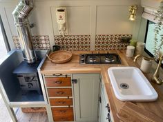 a small kitchen with a sink and stove