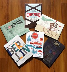 several different types of cards on a wooden table with the chicago sign in the middle