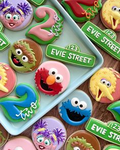 sesame street decorated cookies are on a plate