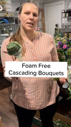 a woman standing in front of flowers holding a sign that says foam free cascading bouquets