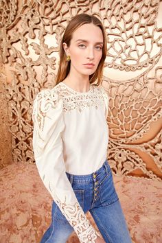 Made from our luxurious Victorian cotton-silk, the Aura Blouse is adorned with intricate Battenberg lace panels that create a decorative floral pattern along the yoke and sculptural long sleeves. It is a timeless pearly white, has a relaxed fit, and fastens with a buttoned keyhole at the back.   Composition: 70% Cotton Timeless Pearly, Battenberg Lace, Nyc Boutiques, Lace Collection, Lace Blouse Long Sleeve, Silk Lace, Knit Sweatshirt, Signature Print, Lace Panelled