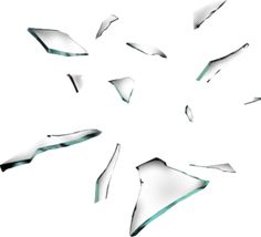 several pieces of broken glass are flying in the air, forming a star shape on a white background