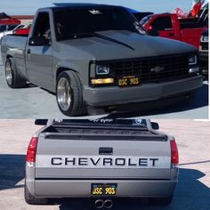 the chevrolet truck is parked in front of other cars and one has a license plate on it