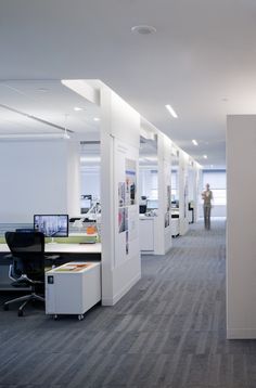 an open office space with desks and computers