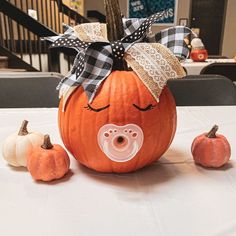 a pumpkin with a pacifier in the center