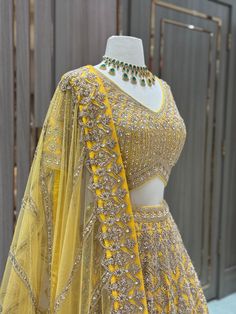 Unleash your daring and stylish side with our Bridal Lehenga BL-311! This stunning mustard yellow lehenga is adorned with intricate zardozi and kundan work, making it a must-have for your sangeet. Stand out and make a statement with this bold and beautiful piece! Fabric: Raw Silk! WASH CARE INSTRUCTIONS - Please Dry clean only when it is applicable! Ready to Ship! Haldi Dress For Bride Indian, Mustard Yellow Lehenga, Haldi Dress For Bride, Haldi Dress, Bride Indian, Dress For Bride, Yellow Lehenga, Kundan Work, Bold And Beautiful