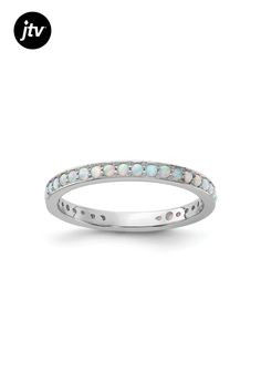 Sterling silver 0.87 cttw round created opal stackable ring with polished finish. Band width measures approximately 1/16". Stackable Ring, Opal Ring, Stackable Rings, Opal Rings, Opal, Lab, Band, Sterling Silver, Ring