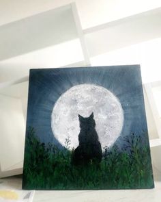 a painting of a black cat sitting in front of a full moon with green grass