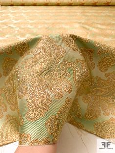 SKU: 15764 Content: 100% Silk Color: Green / Light Brown / Muted Gold Width: 40 inches Festive Jacquard Fabric, Fitted Gold Jacquard Fabric, Elegant Brocade Fabric For Formal Occasions, Gold Elegant Jacquard Fabric, Elegant Gold Jacquard Fabric, Elegant Green Fabric For Festive Occasions, Elegant Green Festive Fabric, Gold Fabric, Silk Necktie