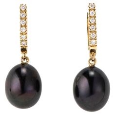 The Black Pearl and Diamond, ear pendants are crafted in 18K yellow gold, hallmarked in Cyprus. These elegant, ear pendants come in a highly polished finish and feature a pair of Black, treated, fresh water Pearls and white Diamonds totaling 0,12 Cts. They are incredibly easy to put on and take off, making them the perfect accessory for any occasion. Whether you are dressing up for a formal event or adding a touch of sophistication to your everyday look, these pendants are sure to impress. The B Luxury Black Round Pearl Earrings, The Black Pearl, Water Pearls, Black Pearl, White Diamonds, Cyprus, Gold Black, Diamond White, Everyday Look