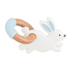 a wooden teethpick with a white rabbit on it's back and blue stripes around its neck