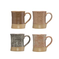 four different colored coffee mugs sitting next to each other