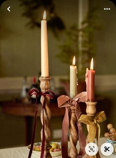 two candles are sitting next to each other on a table