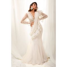 📌Hey! Please message us if you have any questions. We'll definitely assist you. It seems like you're describing a specific type of saree, a "Designer White Organza Trendy Ready To Wear Saree With Fancy Lace Blouse for Women." Let me break down the elements based on your description: 1. Designer White Organza Saree:    - Organza: Organza is a lightweight and sheer fabric that has a smooth texture. It is commonly used in sarees to create an elegant and sophisticated look. 2. Ready To Wear:    - Ready to Wear: This indicates that the saree is pre-stitched or pre-pleated, making it easier to wear without the need for traditional draping. Ready-to-wear sarees are designed for convenience and are a popular choice for those who may not be familiar with the intricacies of saree draping. 3. Fancy Western Outfit For Women, Saree For Reception, Indian Reception Outfit, Indo Western Outfit, Lehenga Sari, Skirt Bridesmaid Dresses, Skirt Saree, Sari Lehenga, Baju Kahwin