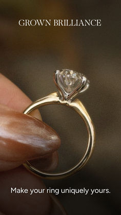 a woman's hand holding an engagement ring with the words grow in brilliantance