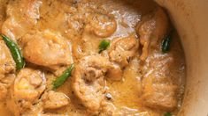 a close up of food in a pot on a table