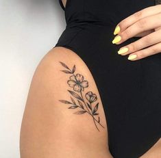 a woman's thigh with flowers on it