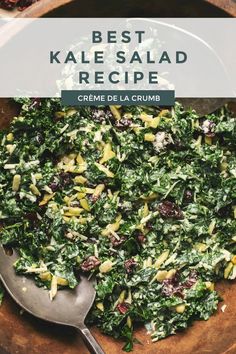 kale salad with creme de la crumbs in a wooden bowl on a table