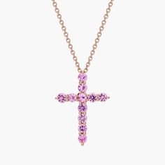 Let your faith shine when you wear this beautiful cross pendant featuring petite pink sapphire shimmering along its arms. The warm gleam of the 14k rose gold design perfectly complements the color of the stones. Beautiful Cross, Cross Jewelry, Cross Pendant Necklace, Gold Design, Pink Sapphire, Cross Pendant, Sapphire, Rose Gold, Pendant Necklace