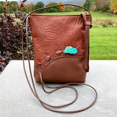 "This small Crossbody Phone Bag Is the Bag to grab when you are rushing out the door and want to carry only what you really need! A Minimalist design with one large section-big enough for any phone, a flat wallet (I make those too!)and your keys There's a Clip Off Key Chain on the inside. Strap is long and adjustable. The Design is the fun part...Rustic Leather handlaced for a Tribal look. And accented with an Aqua Terra Jasper Gemstone. This Designer Original is limited by how many Raw Edges of Leather Rectangular Bucket Bag With Cell Phone Pocket, Rectangular Leather Bucket Bag With Cell Phone Pocket, Leather Shoulder Bag Pouch For Errands, Brown Satchel Pouch With Cell Phone Pocket, Rectangular Leather Pouch For Errands, Removable Pouch Crossbody For Errands, Leather Bag With Cell Phone Pocket For Errands, Leather Phone Bag For Everyday Use, Daily Use Crossbody Bucket Bag With Cell Phone Pocket