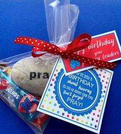 a birthday gift bag with bread and candy