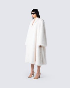 A coat that makes a statement 💋 Step out on those chilly streets while bringing the heat in this ivory midi vegan fur coat 🔥 Chic Oversized Faux Fur Coat, White Fur Coat For Fall, Oversized White Fur Coat For Fall, Oversized White Fur Coat For Winter, Luxury Faux Fur Spring Coat, Luxury Faux Fur Winter White Outerwear, Winter White Long Fur Coat With Faux Fur Trim, Oversized White Fur Coat, Luxury White Outerwear With Faux Fur Lining