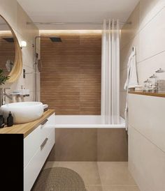 a bathroom with a sink, mirror and bathtub next to a shower curtain on the wall