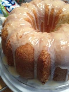 a bundt cake with icing sitting on a plate