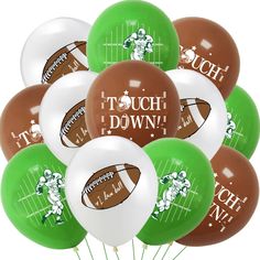 a bunch of balloons that say touch down with footballs on them in green, brown and white