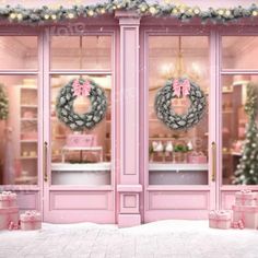 a pink store front decorated with wreaths and presents